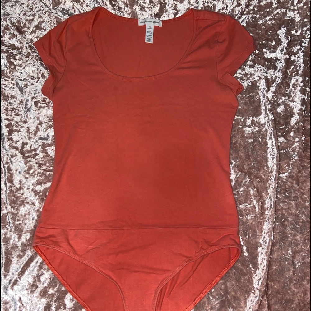 Orange body suit
